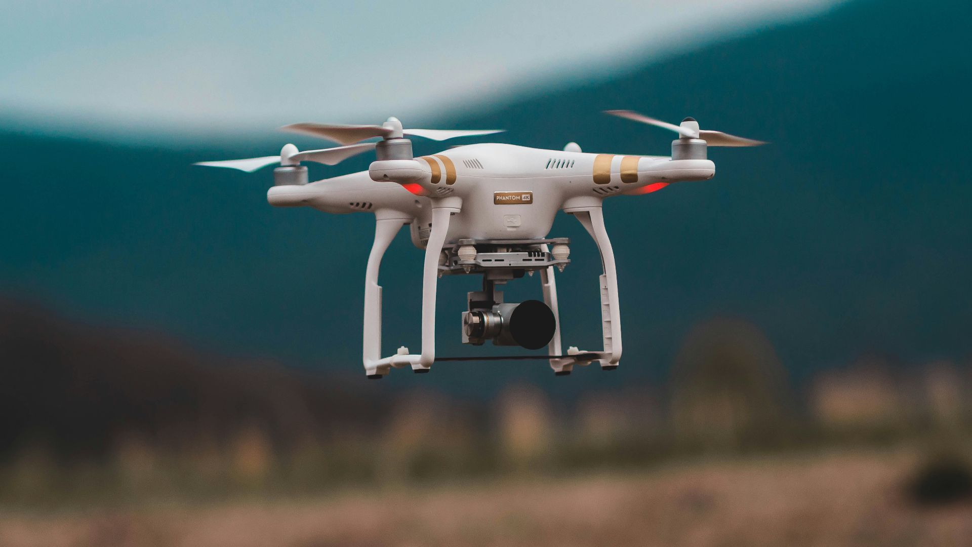 selective focus photography of DJI Phantom 3 Professional quadcopter drone