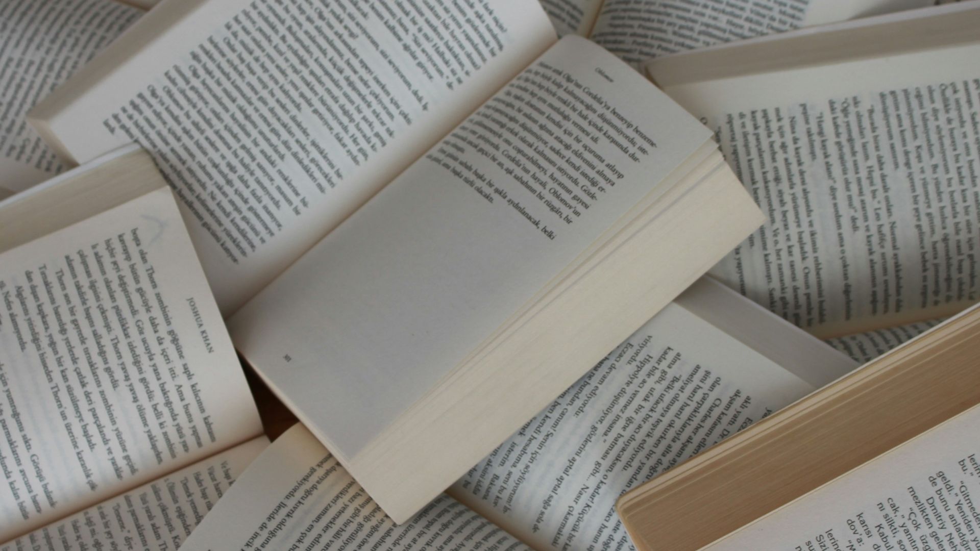 white and brown book on brown woven surface