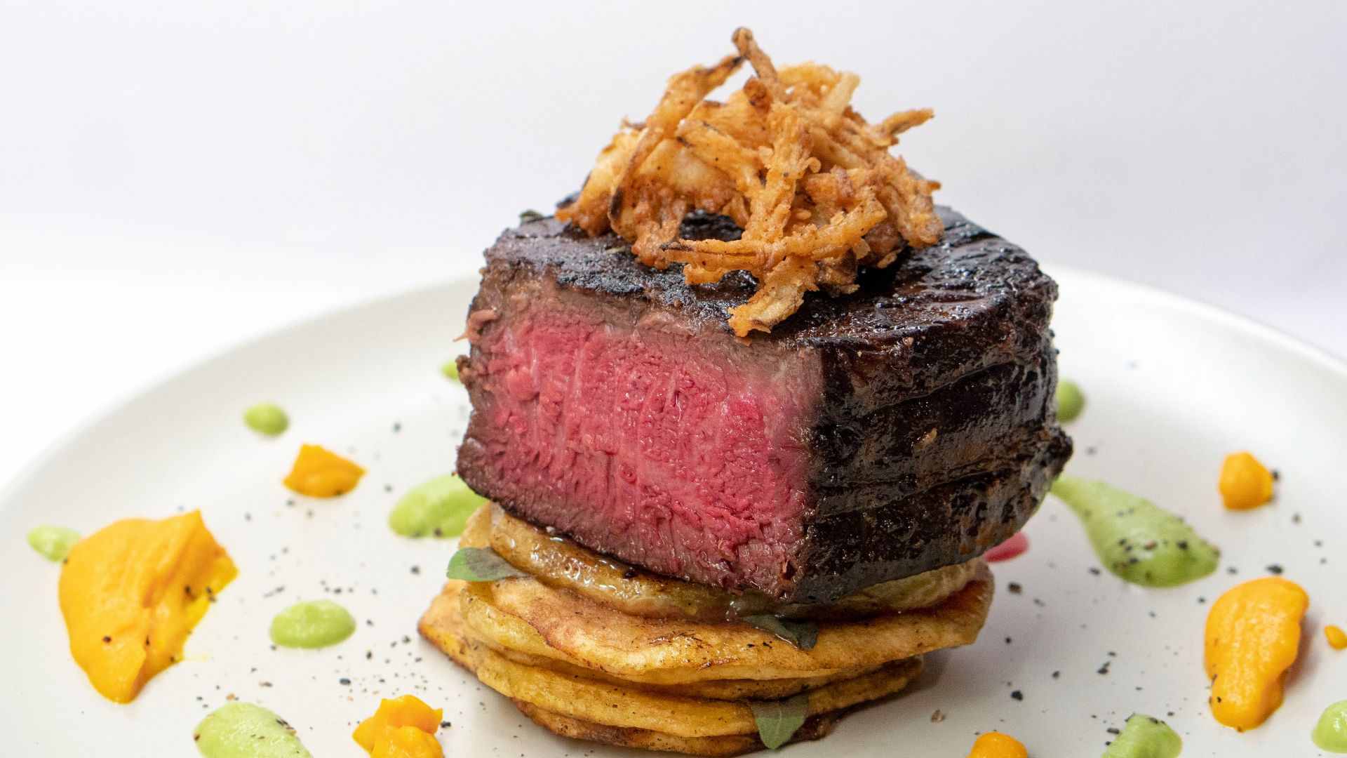brown bread with cheese on white ceramic plate