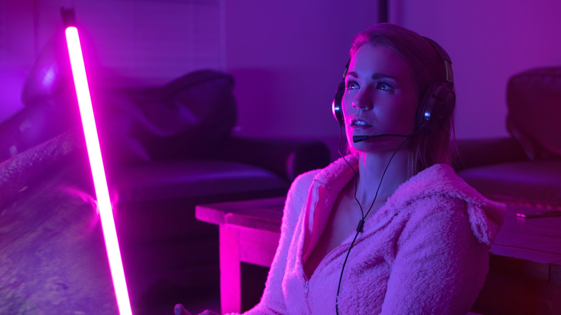 woman in white robe sitting on couch