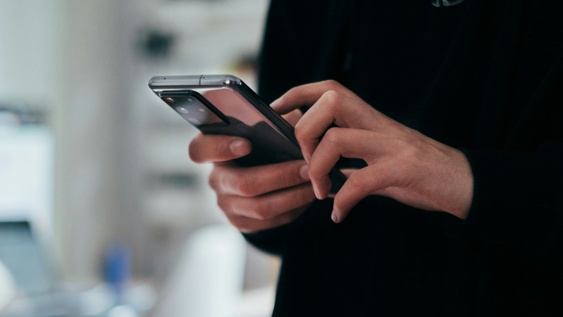 person holding black android smartphone