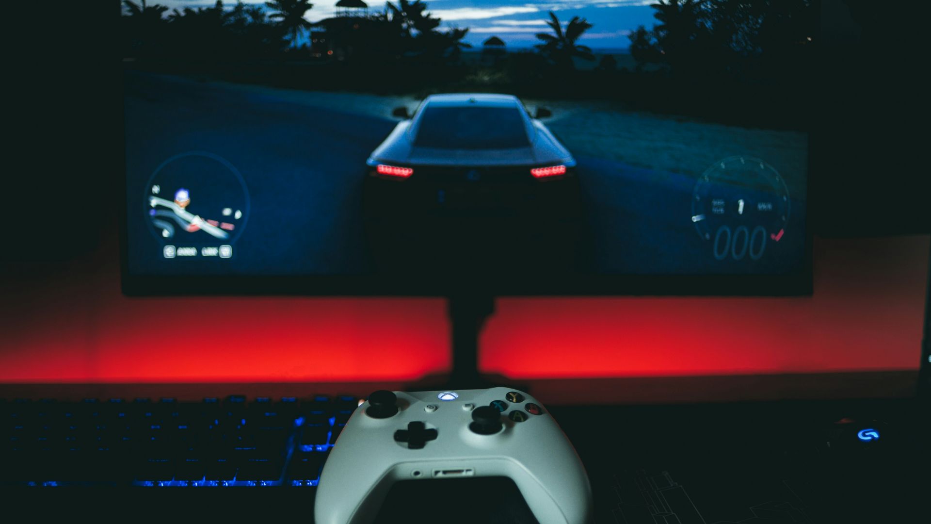 a video game controller sitting in front of a monitor