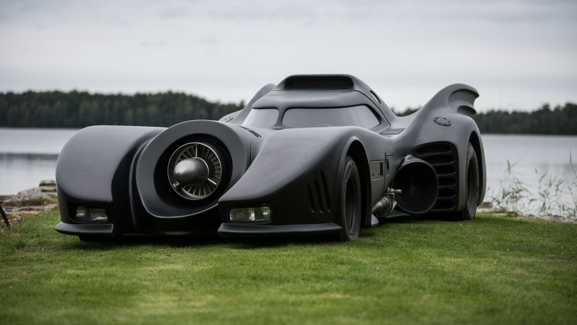 a car that is sitting in the grass