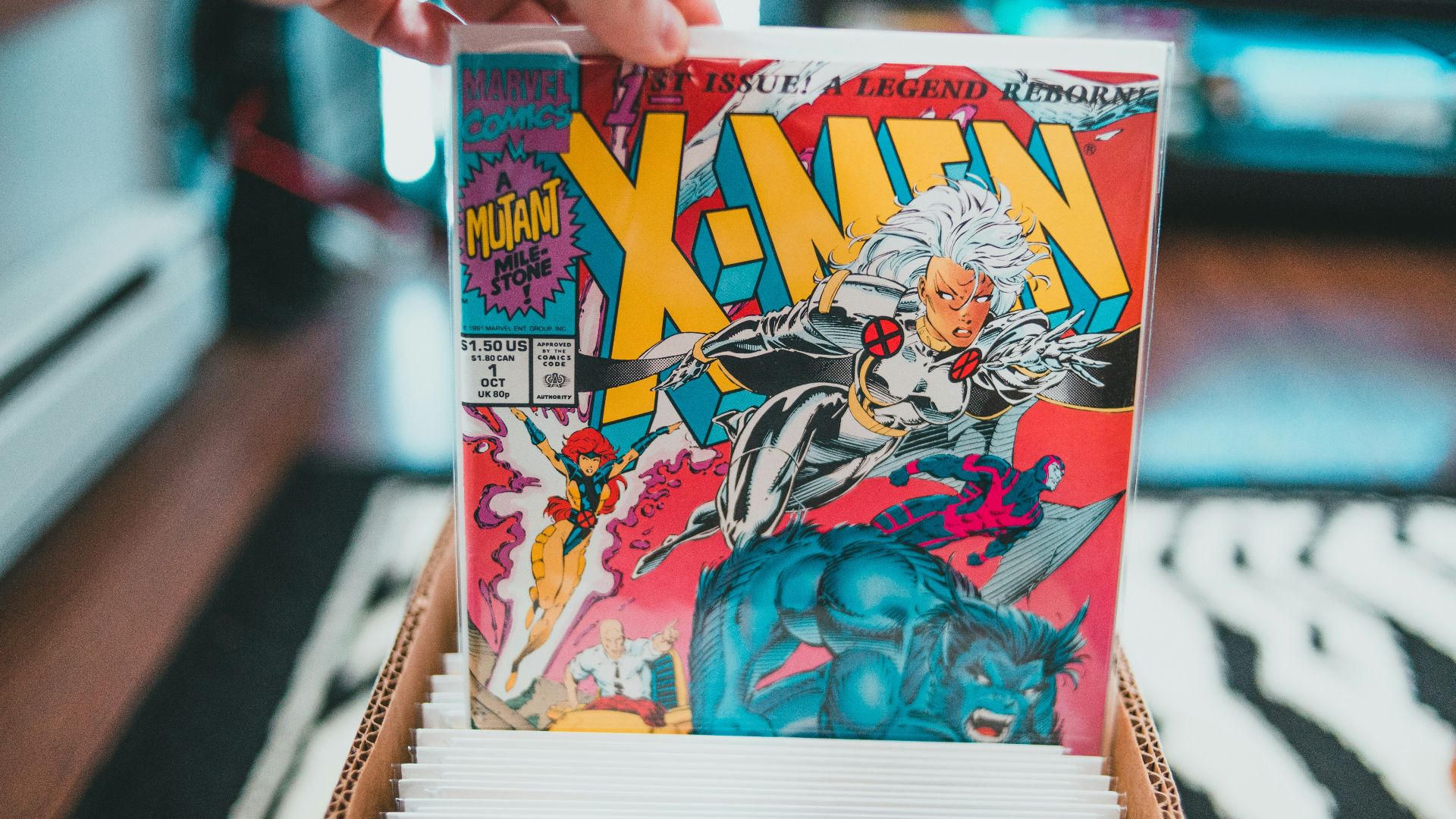a person holding a comic book in their hand