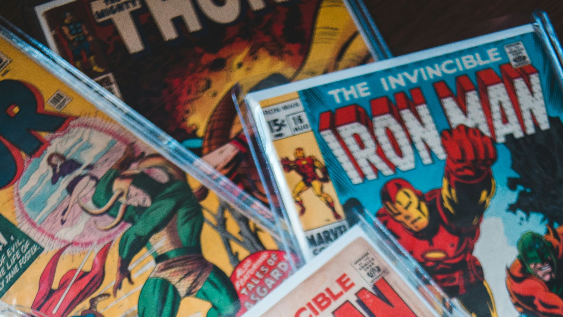 a pile of comics sitting on top of a table