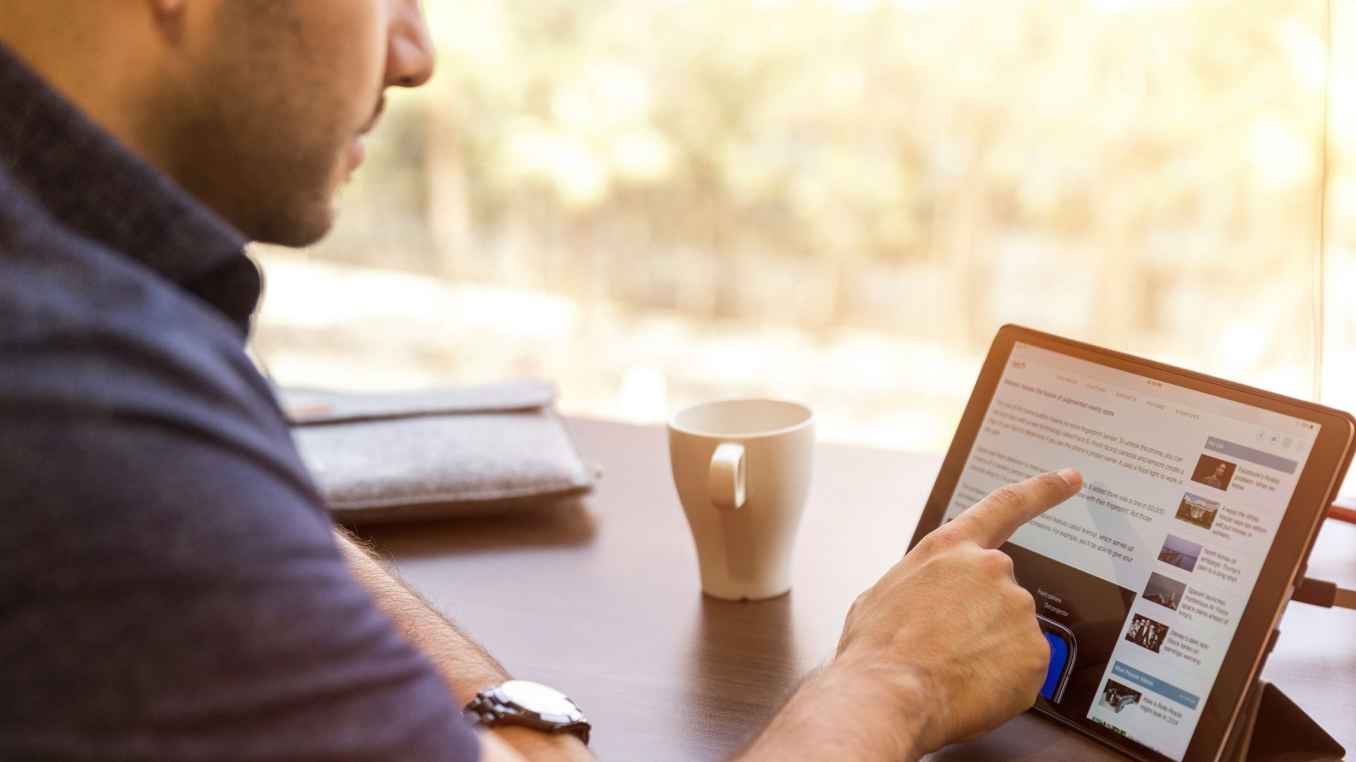 man holding tablet computer