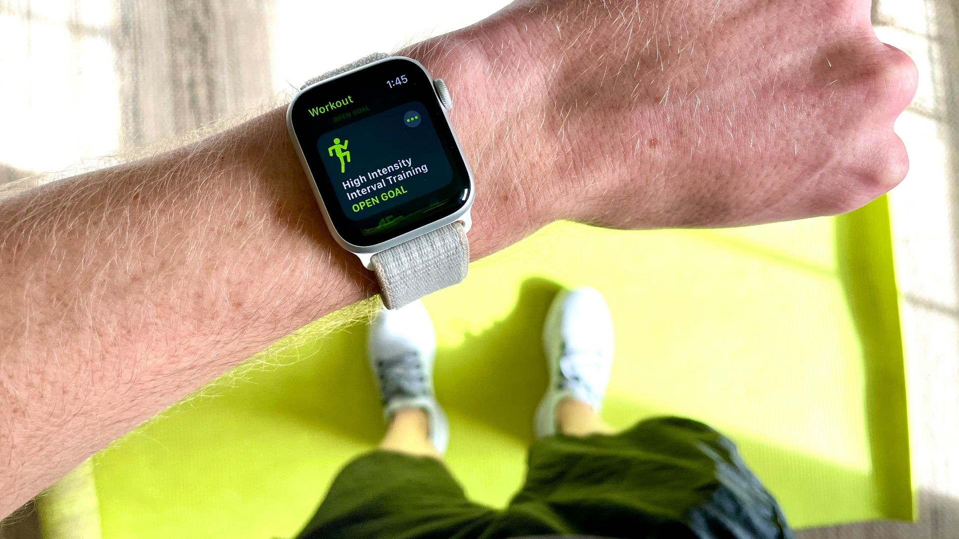 silver aluminum case apple watch with white sport band