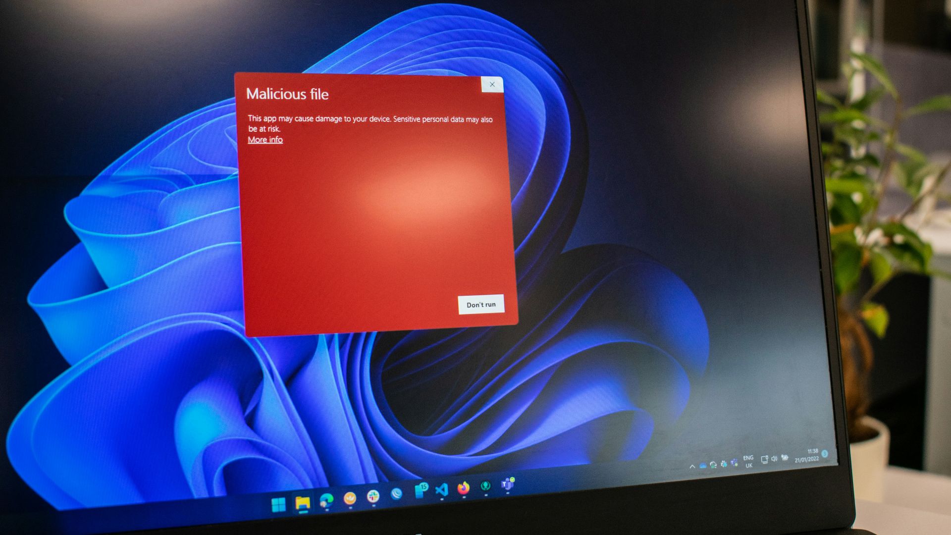 a dell laptop computer with a red screen