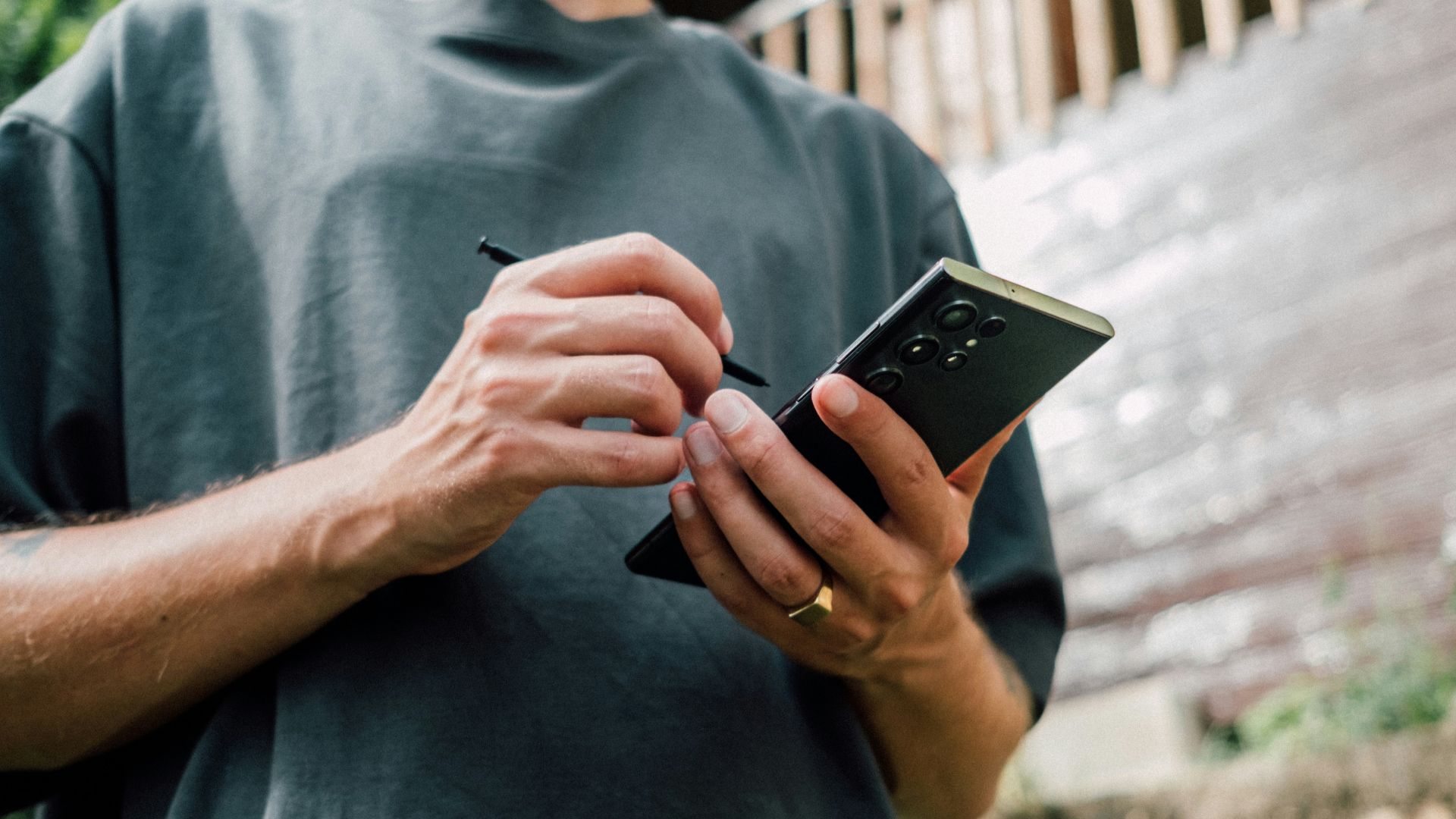 a man holding a cell phone in his hands