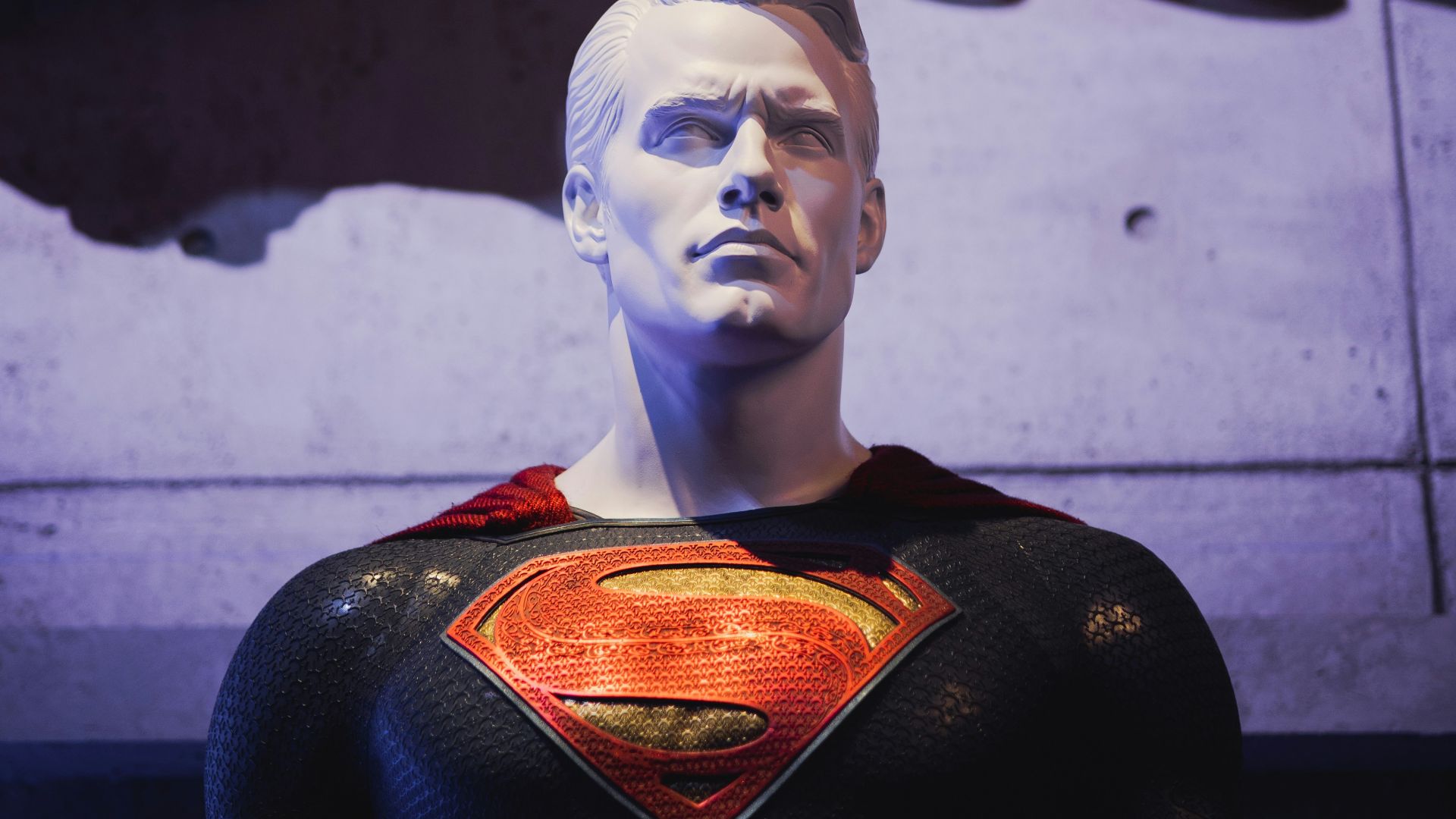 a statue of a man in a superman suit