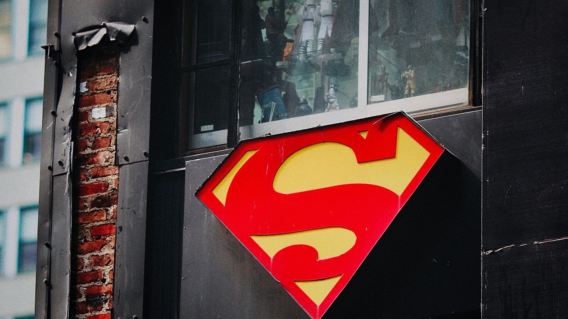 red and yellow heart sticker on black wooden door