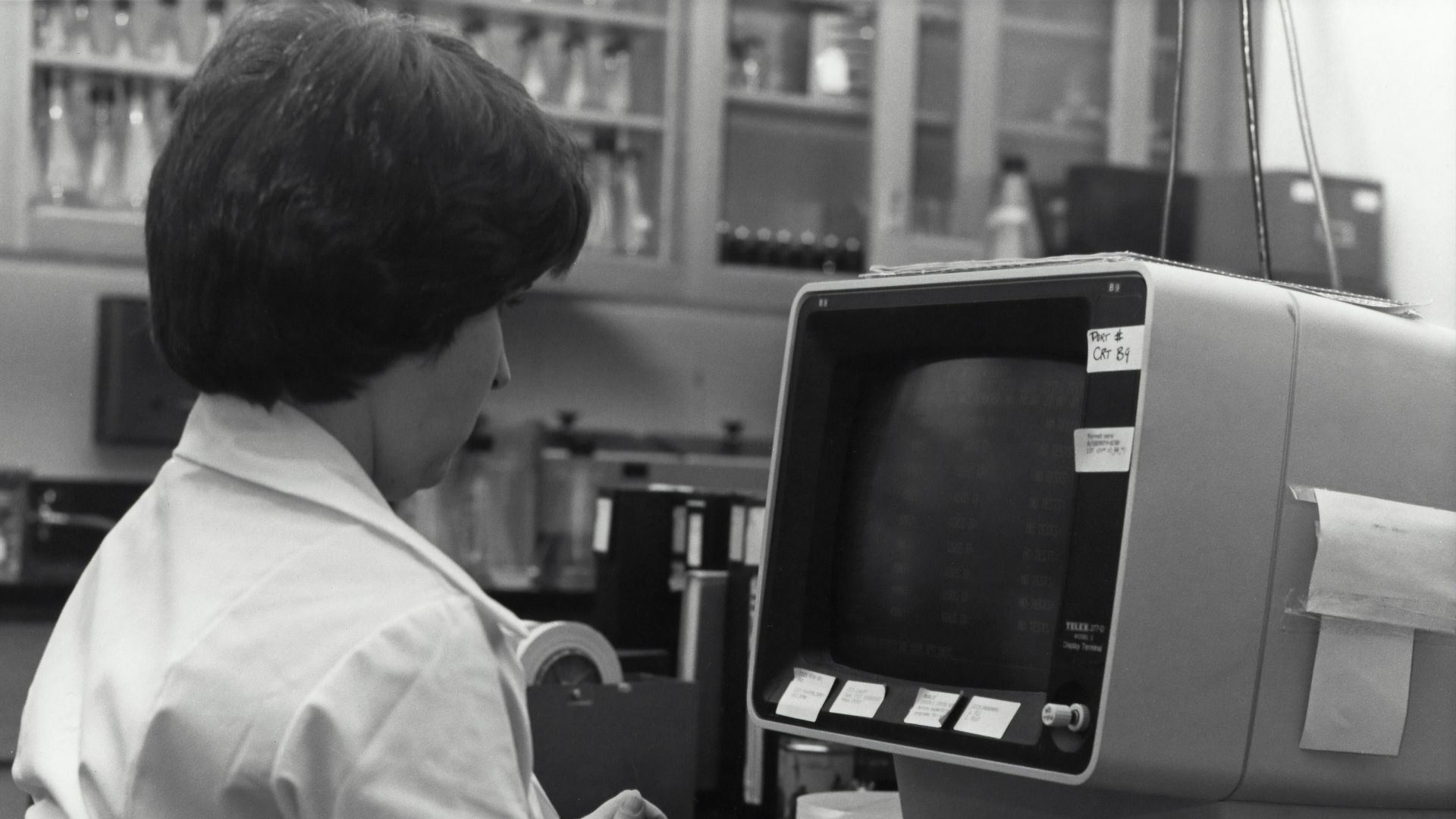 grayscale photography of unknown person using computer