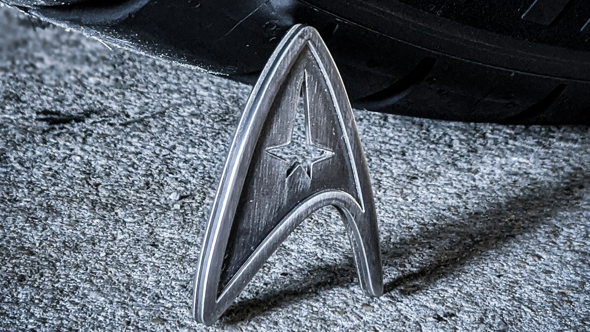 a star trek emblem on the side of a car tire