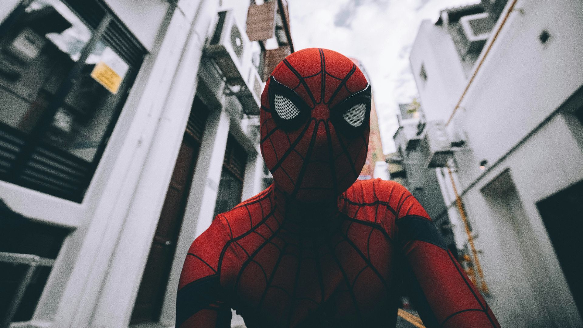 Spider-Man standing in the middle of buildings