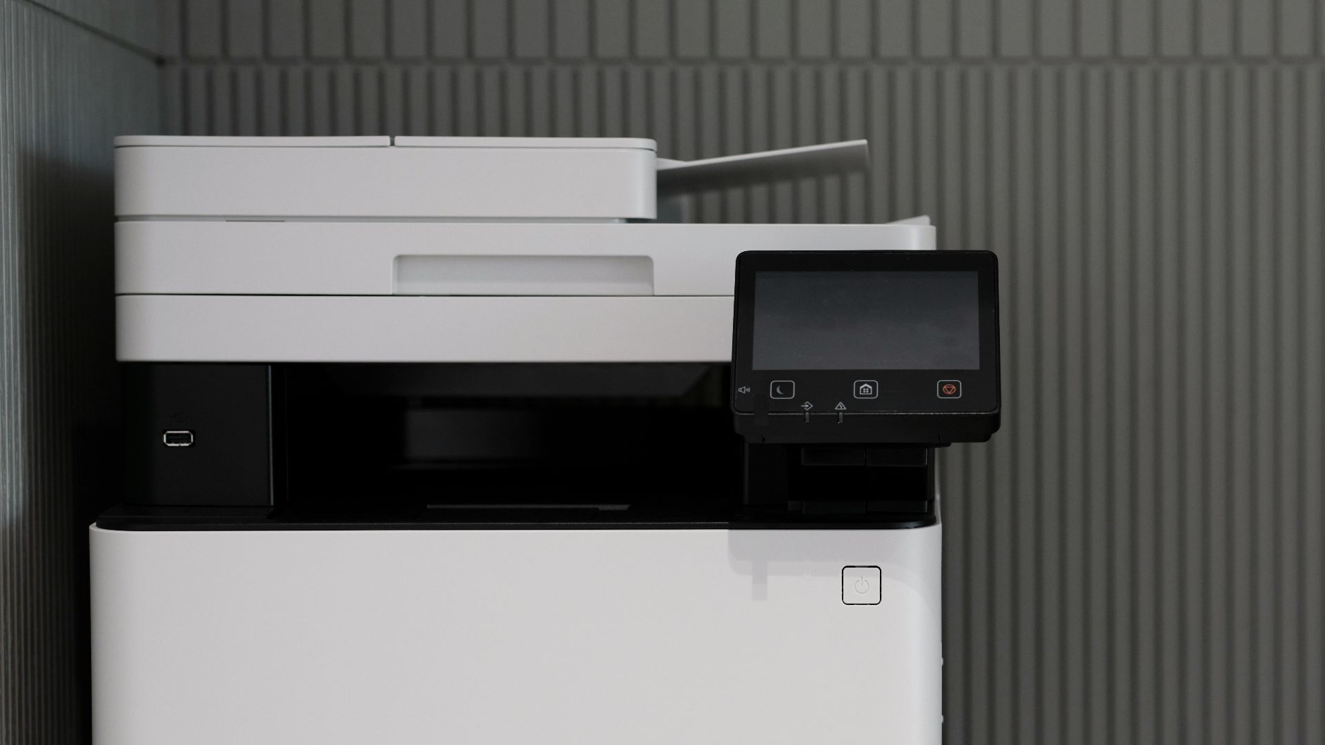 a white and black printer sitting on top of a counter