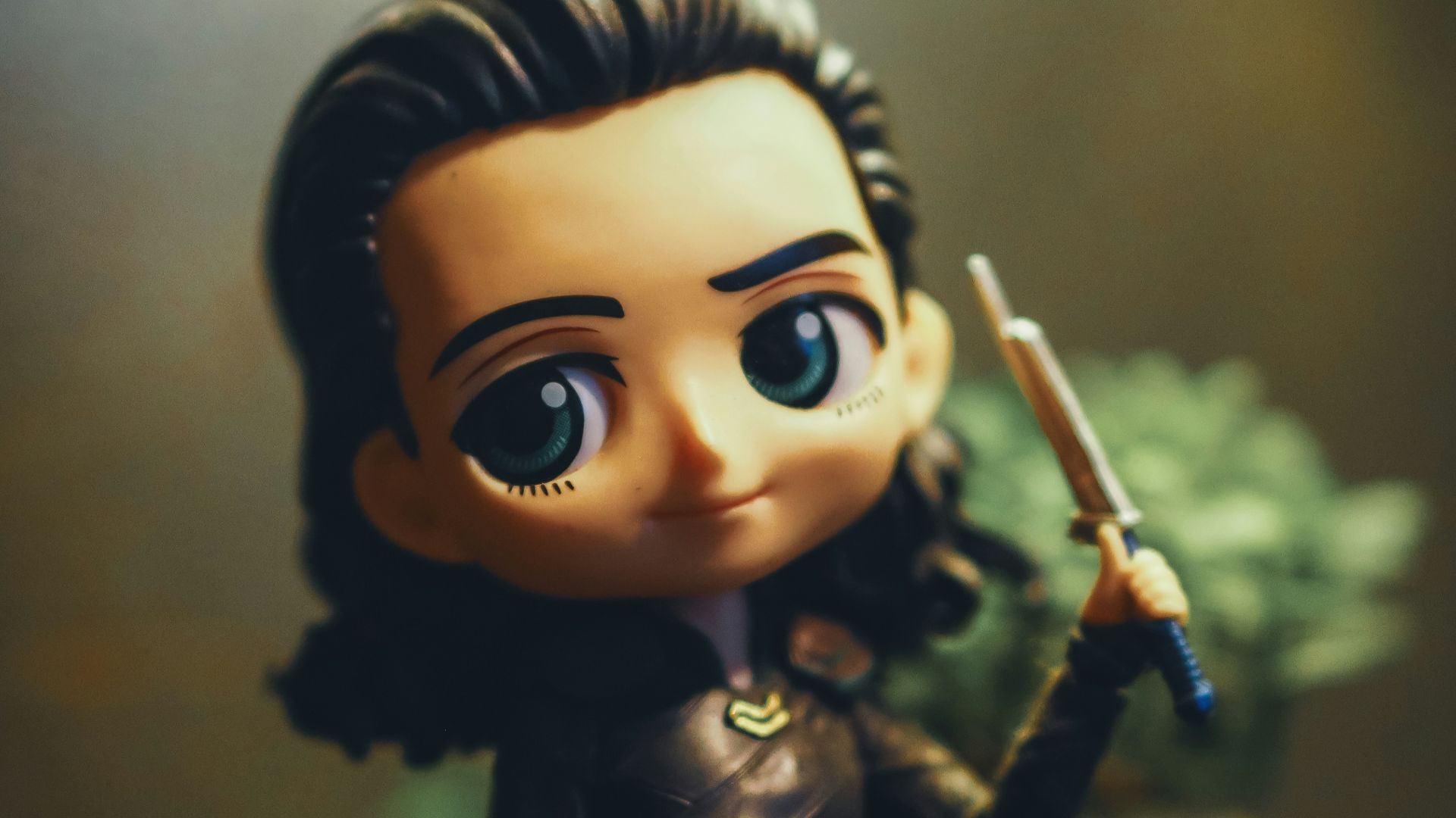 a close up of a figurine of a person holding a sword