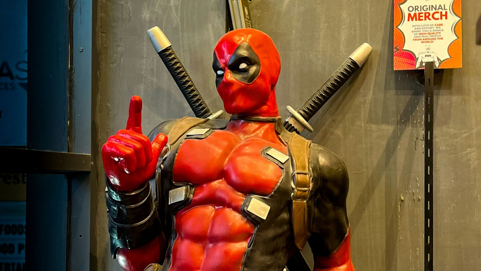 a statue of a man dressed as a deadpool
