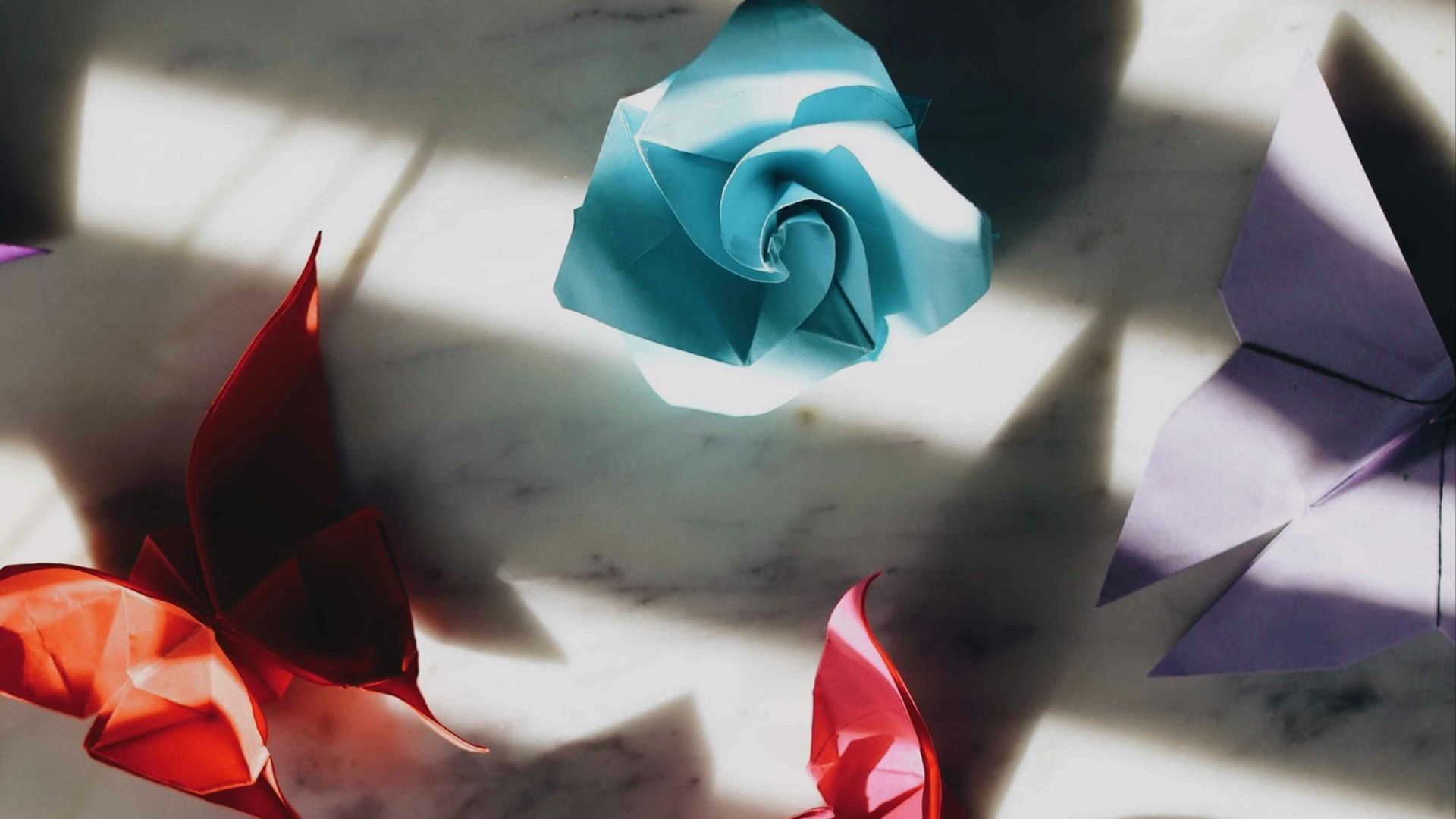 white and red paper boat on white surface