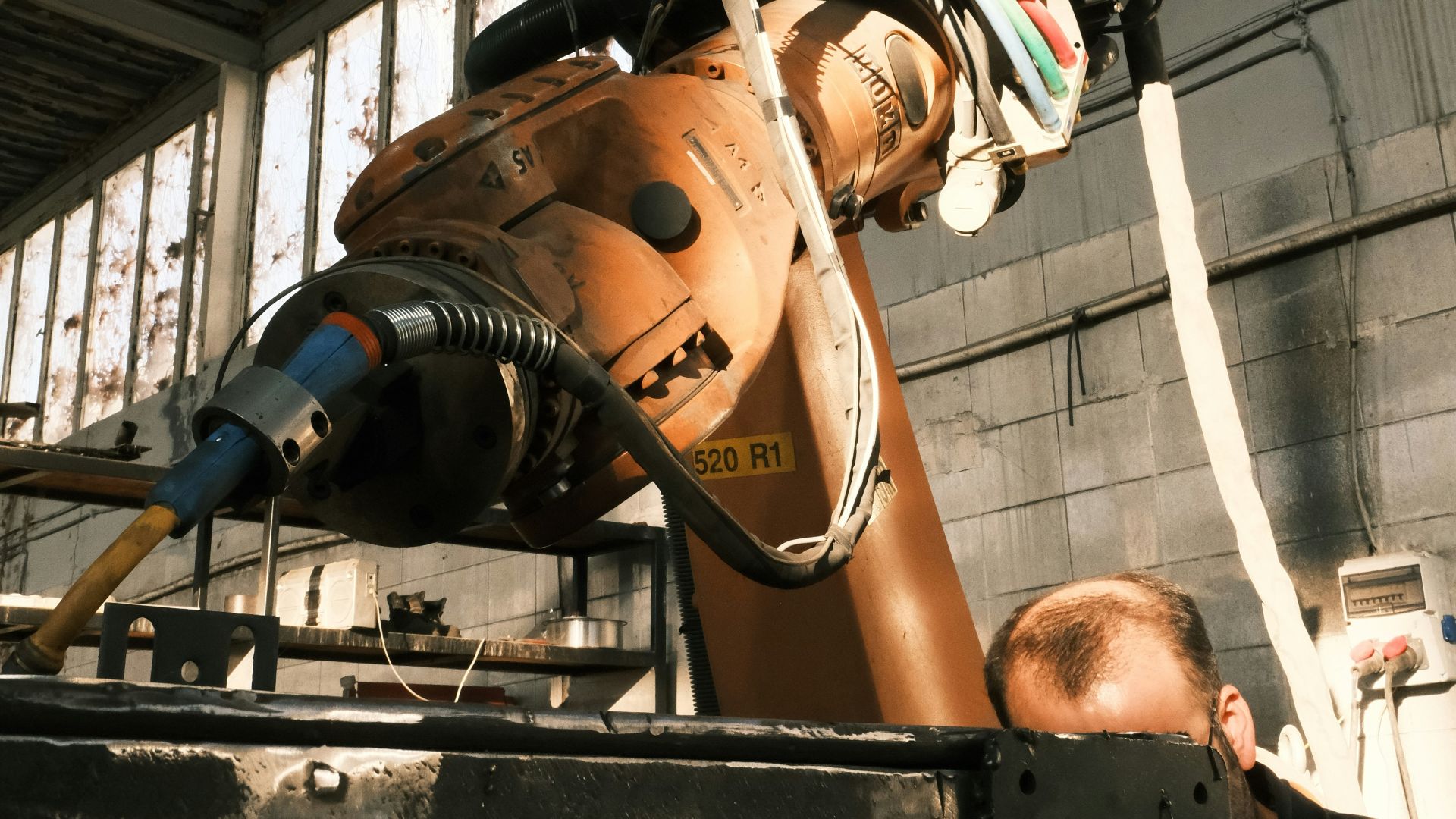 A man working on a machine in a factory