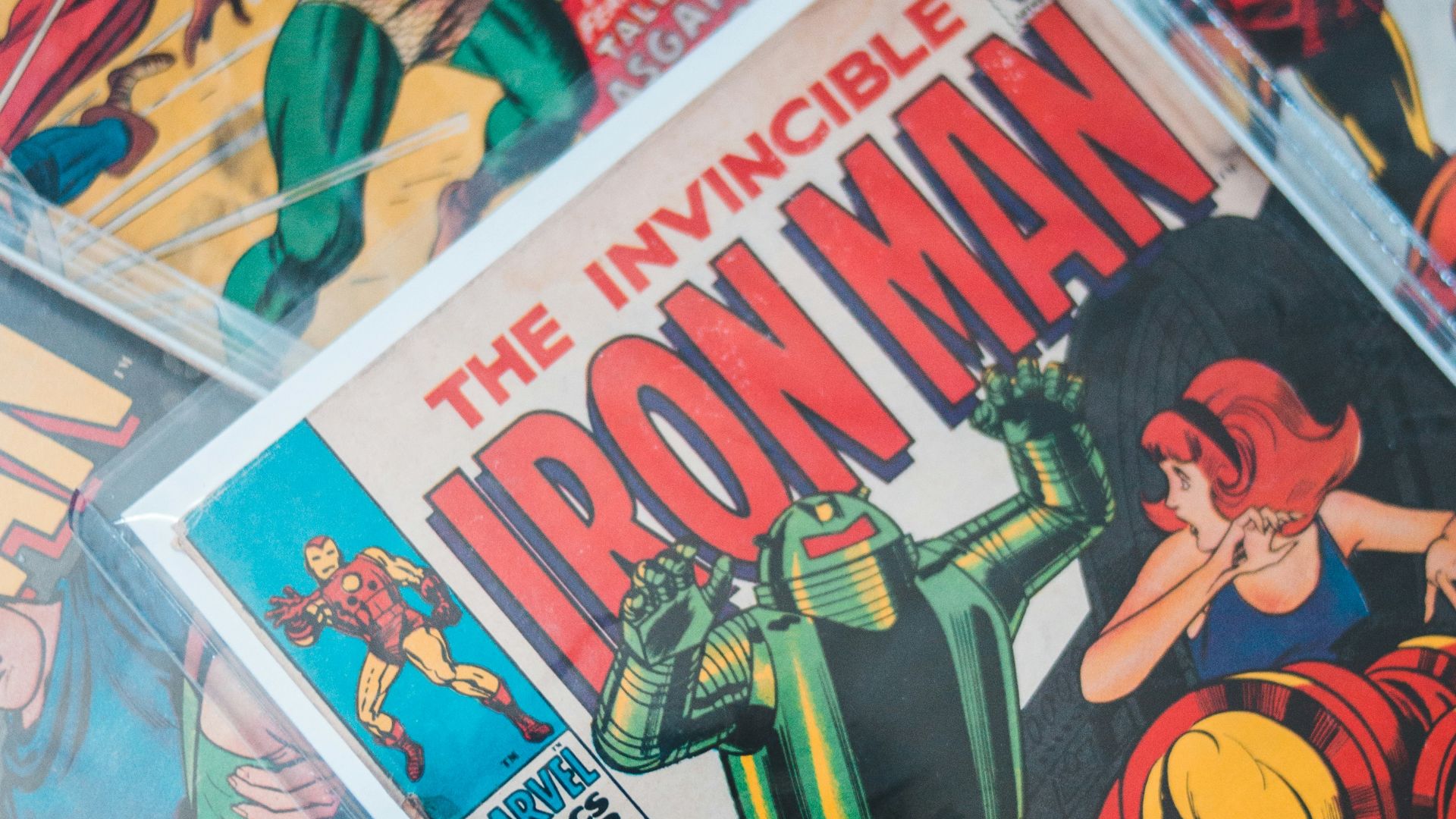 a pile of comics sitting on top of a table