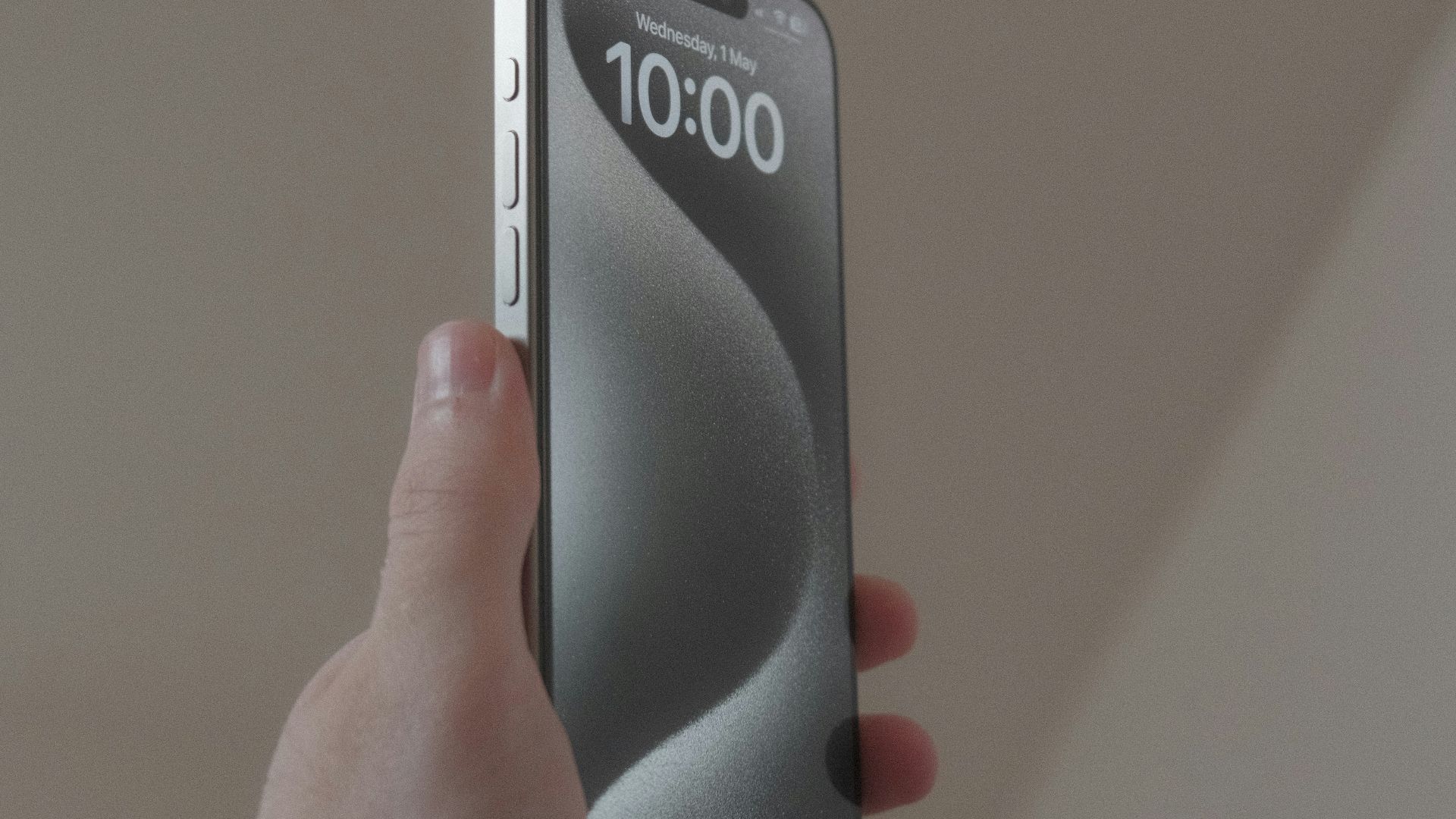 a person holding a cell phone in their hand