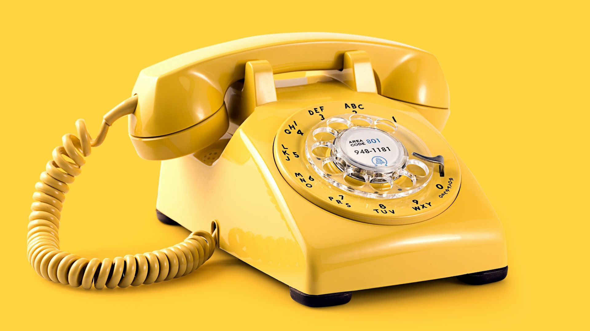 yellow rotary telephone