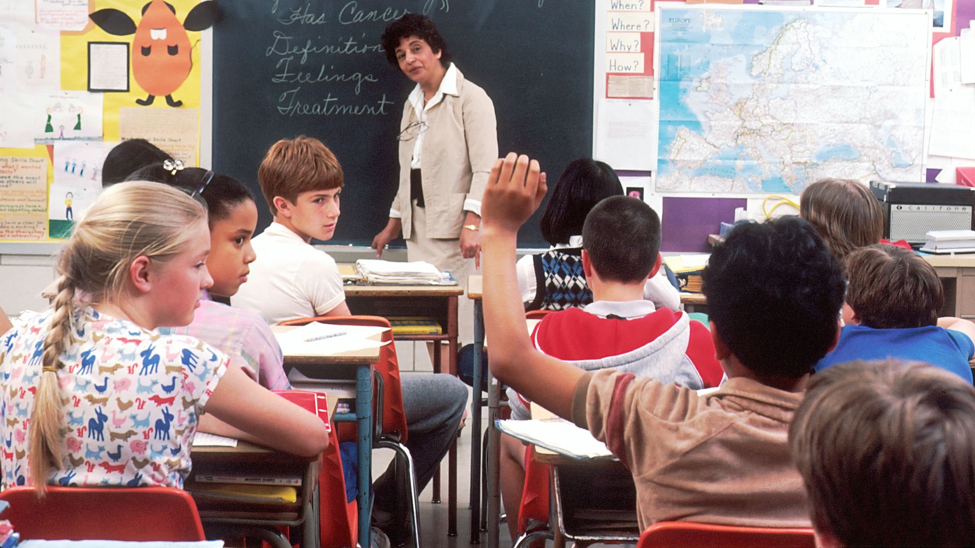 woman standing in front of children