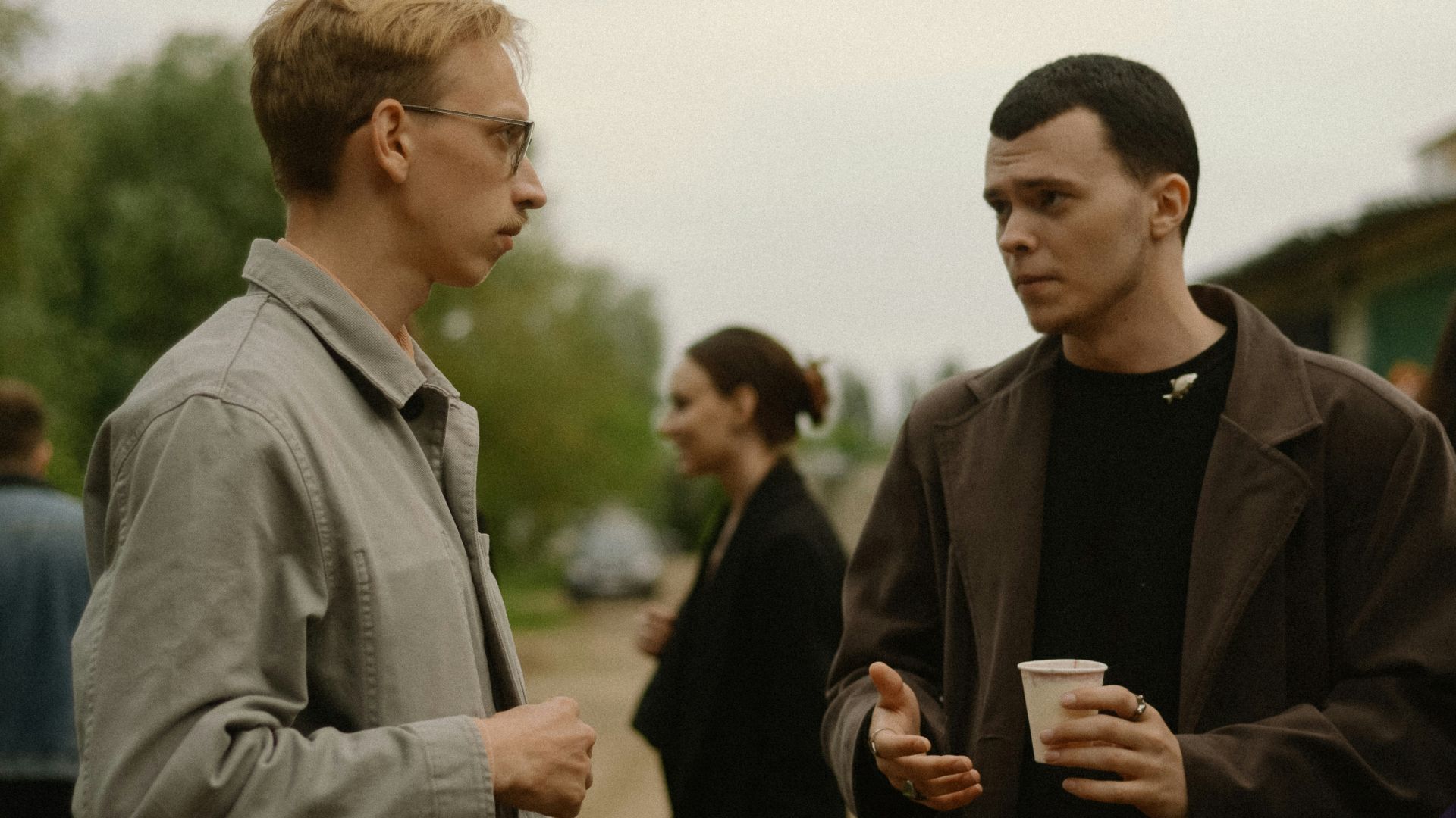 a couple of men standing next to each other