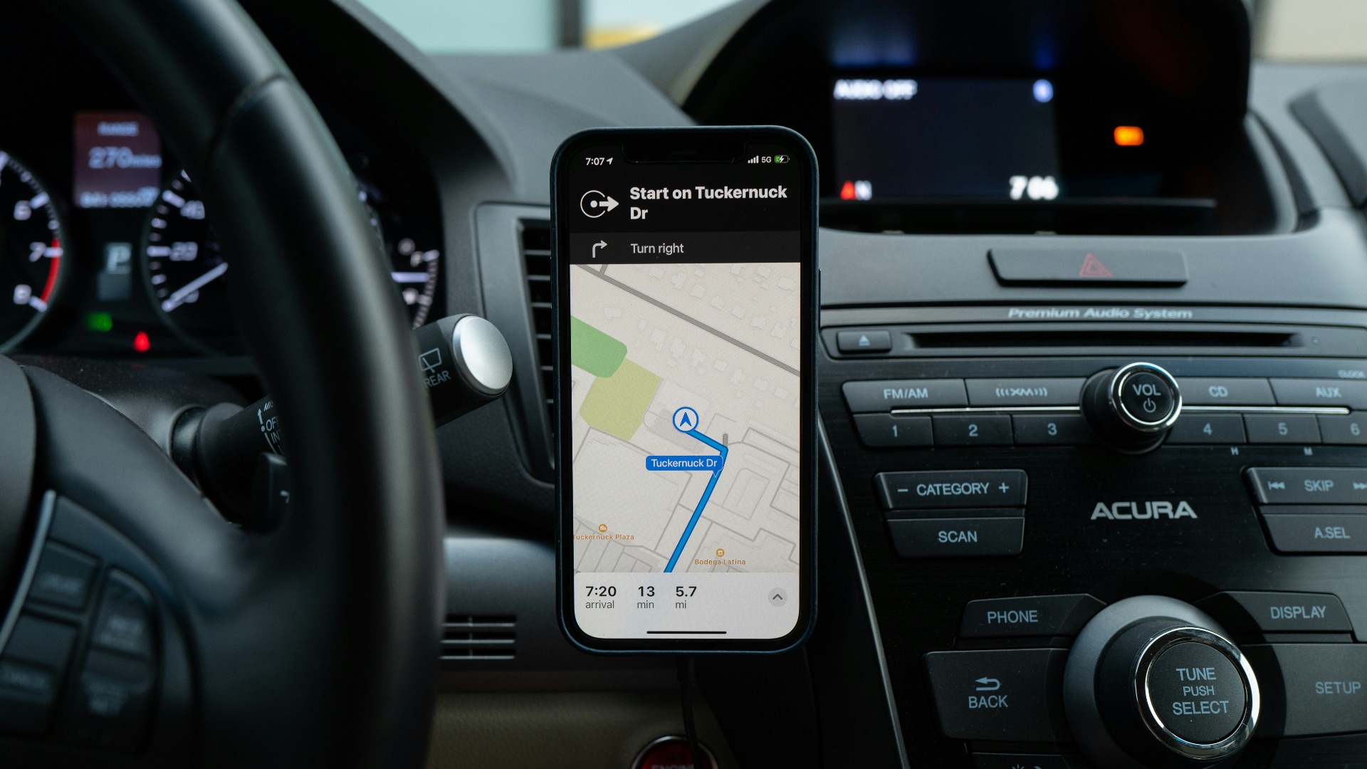 black android smartphone on car center console