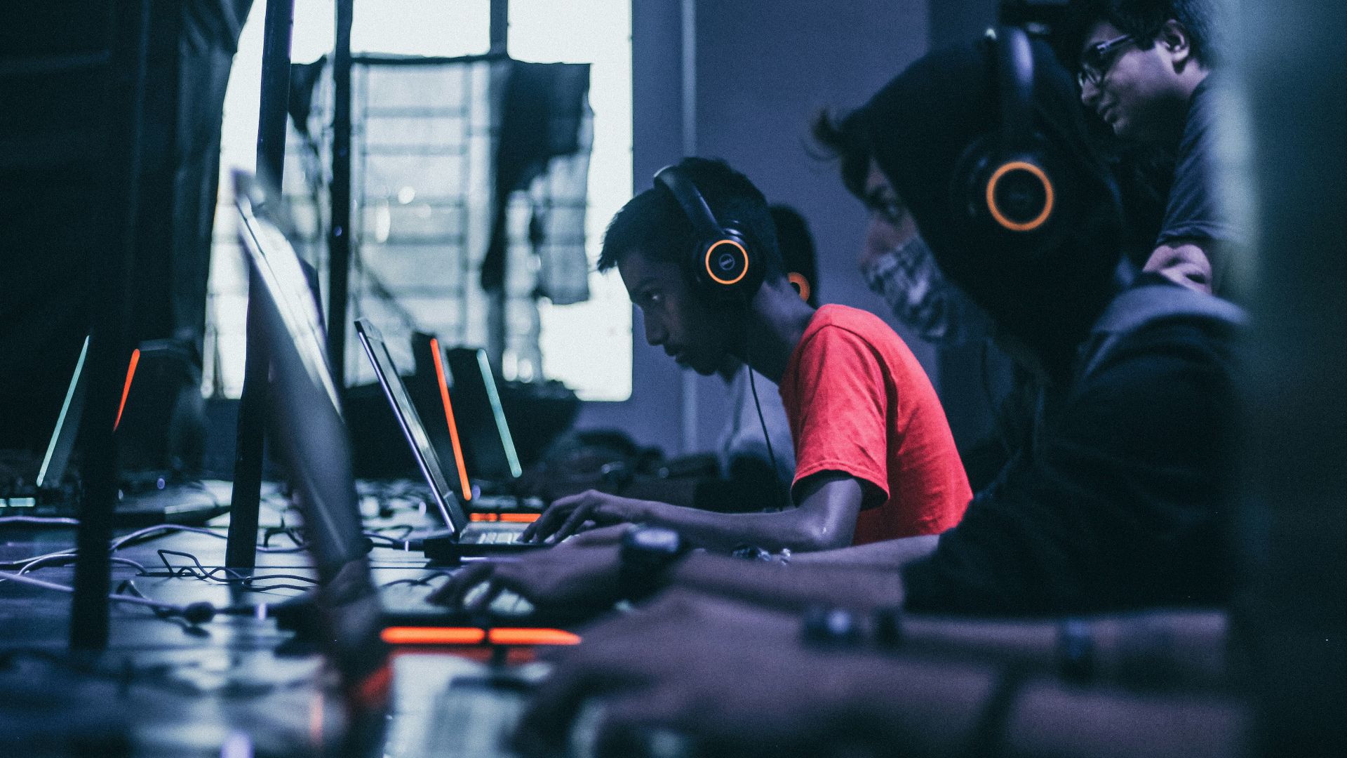 man playing on laptop