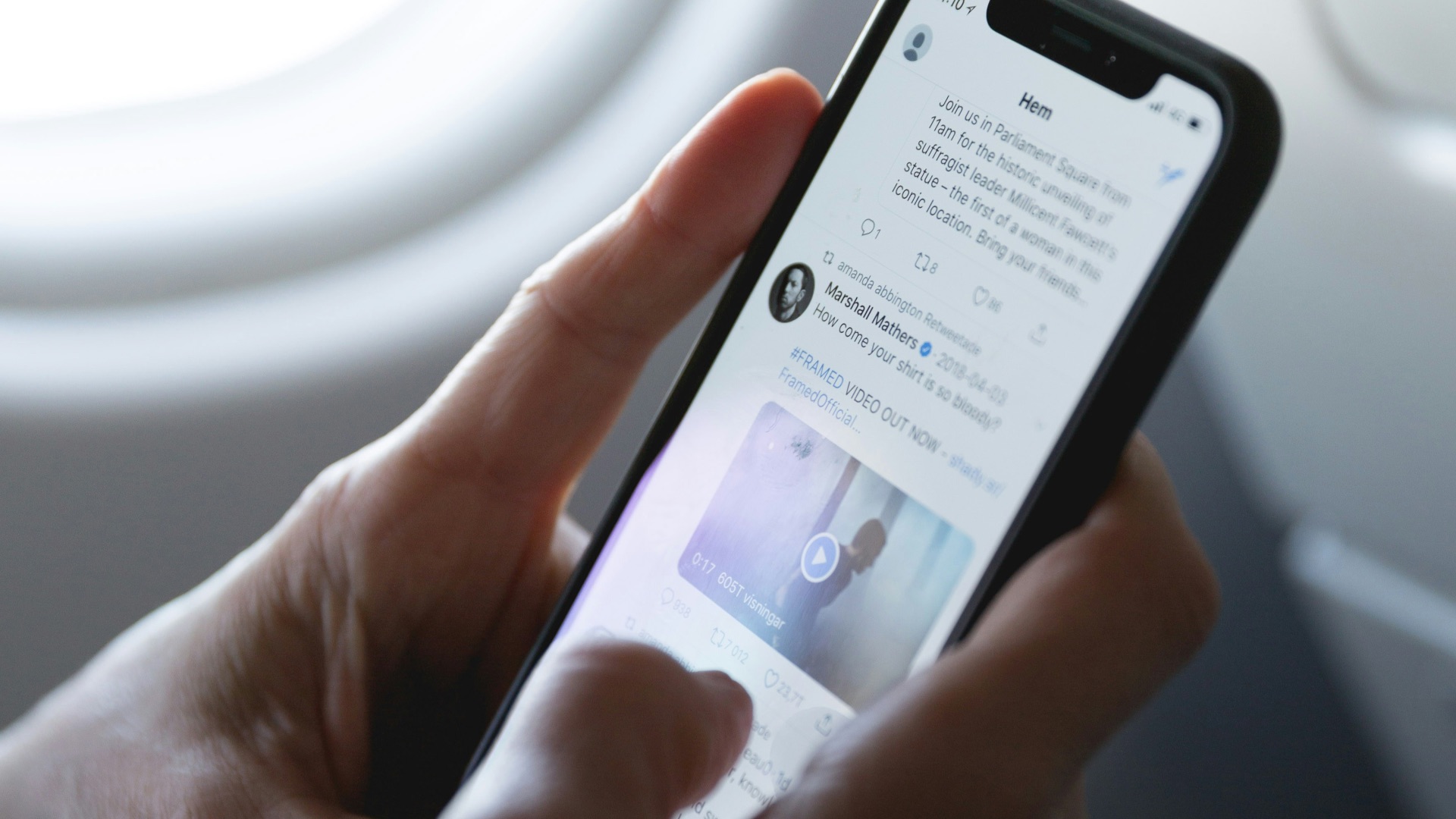 person holding space gray iPhone X