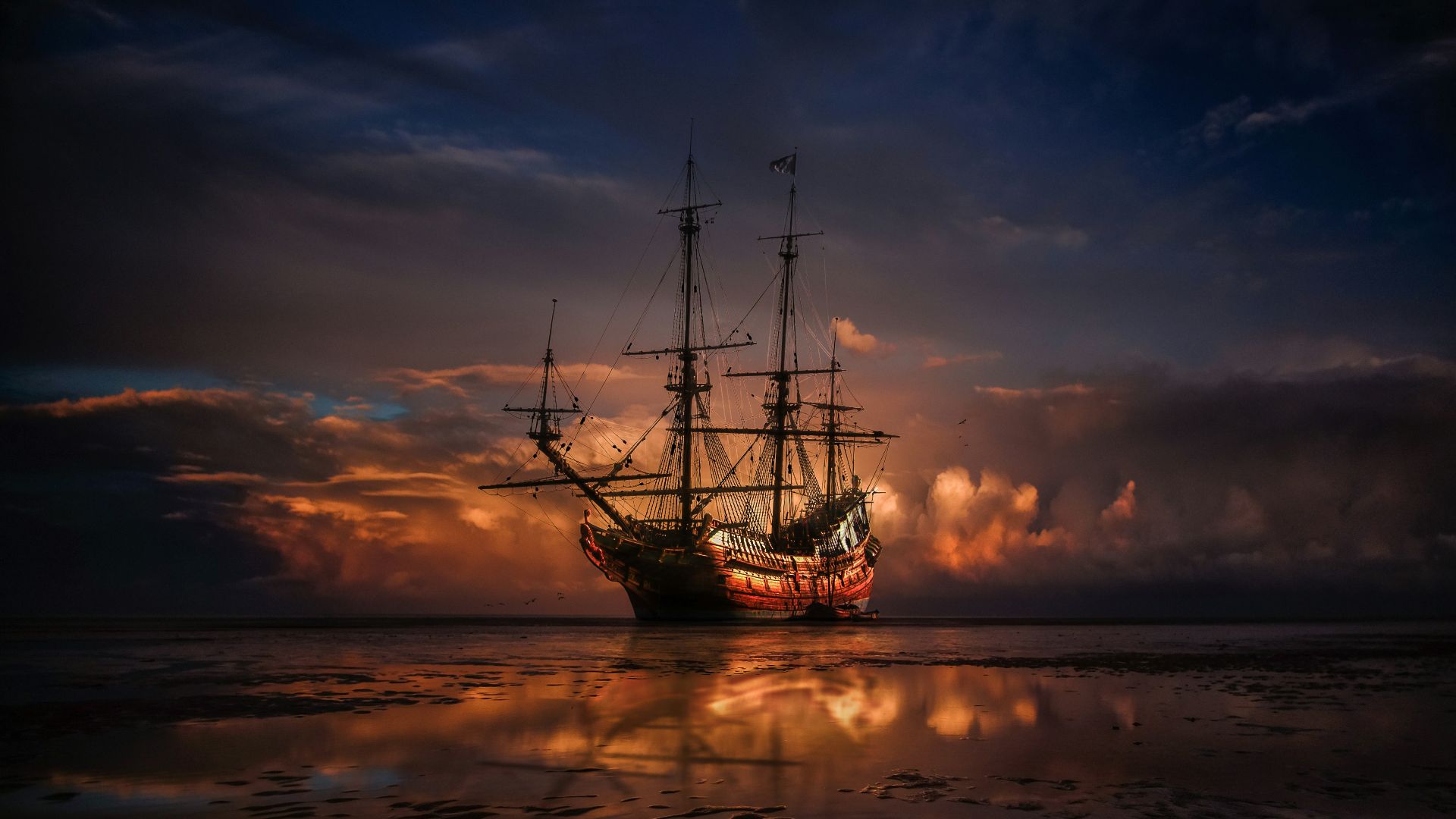 brown ship on sea during sunset