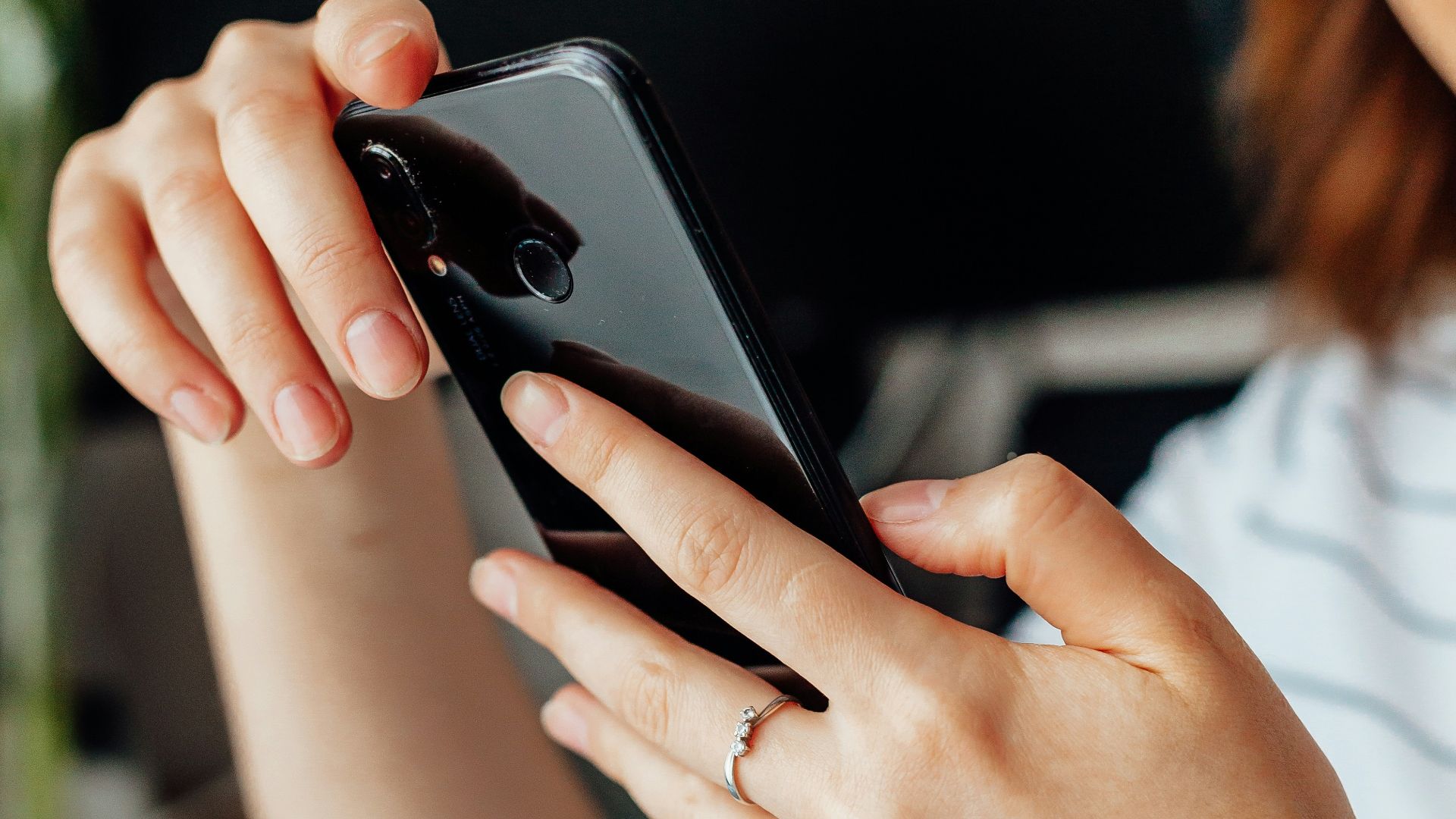 a close up of a person holding a cell phone
