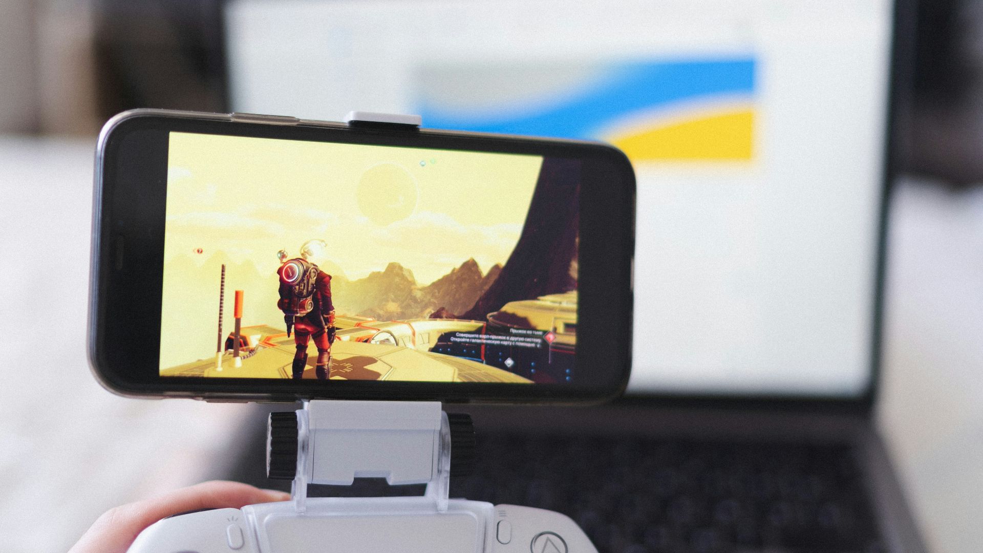 person holding white and black camera