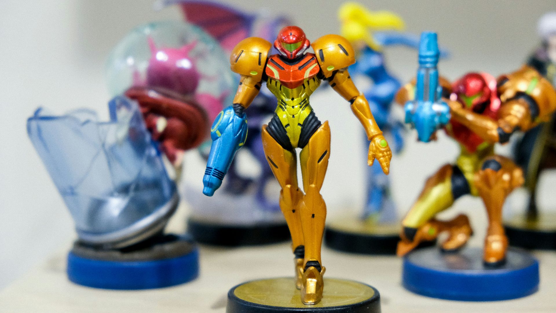 man wearing yellow and red costume character scale model