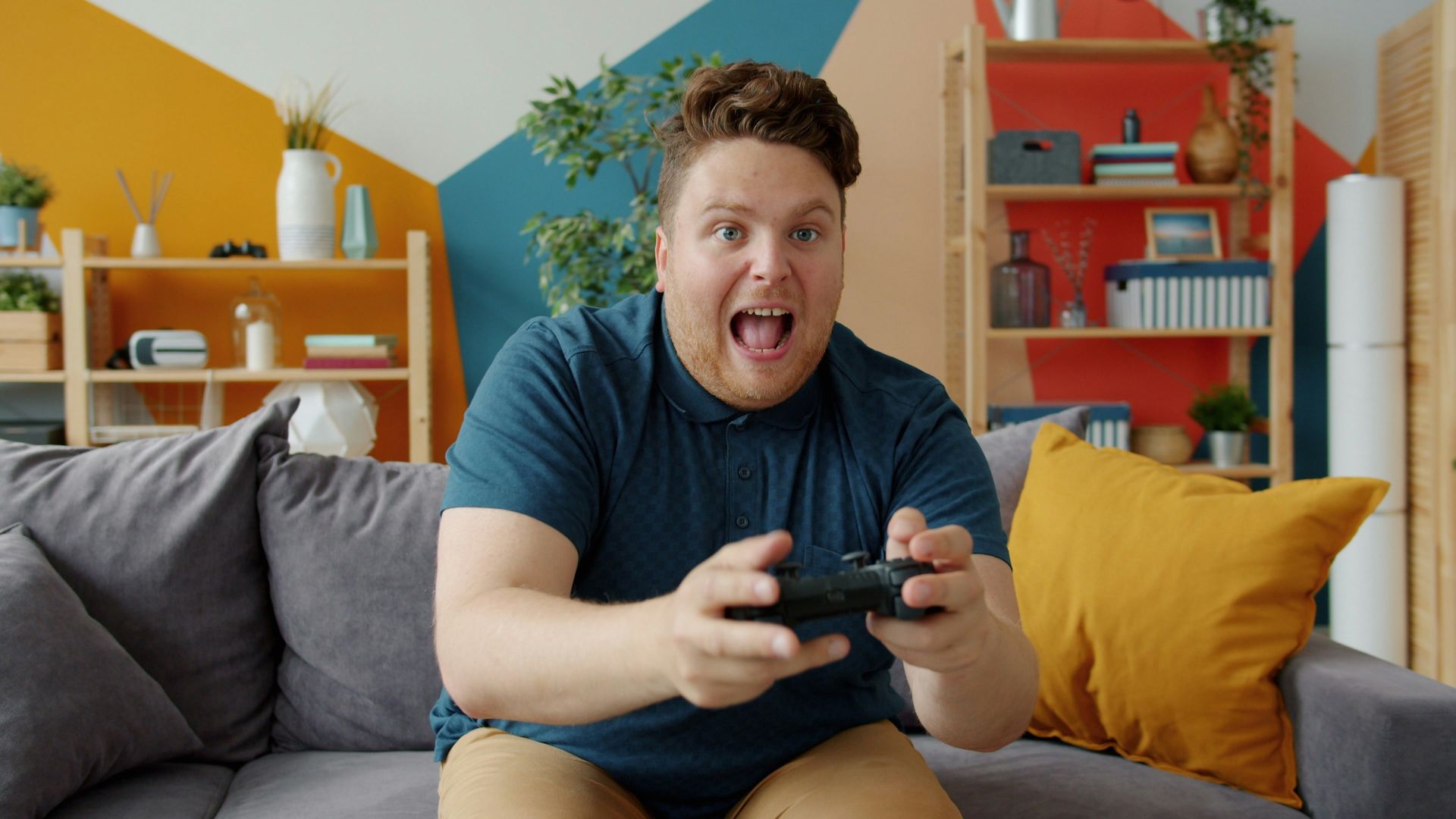 Man playing video games with excited expression