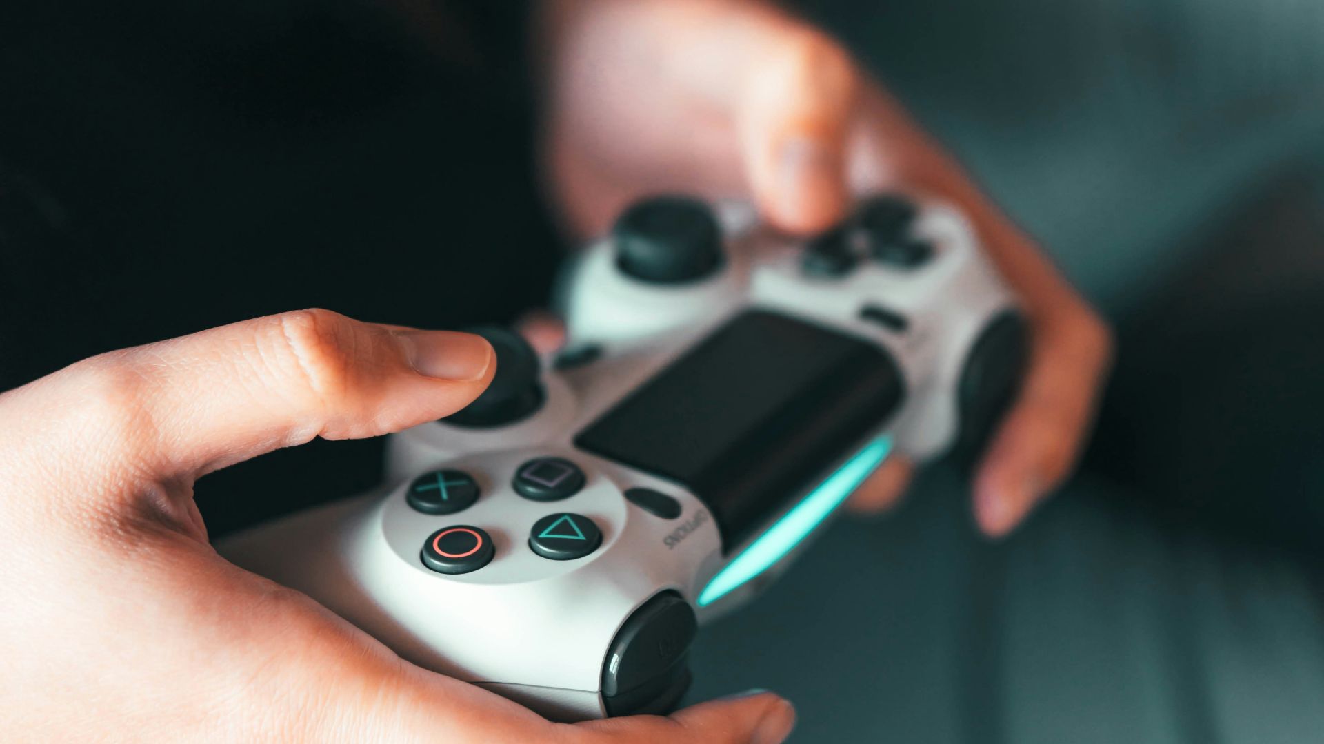 person holding gray game controller