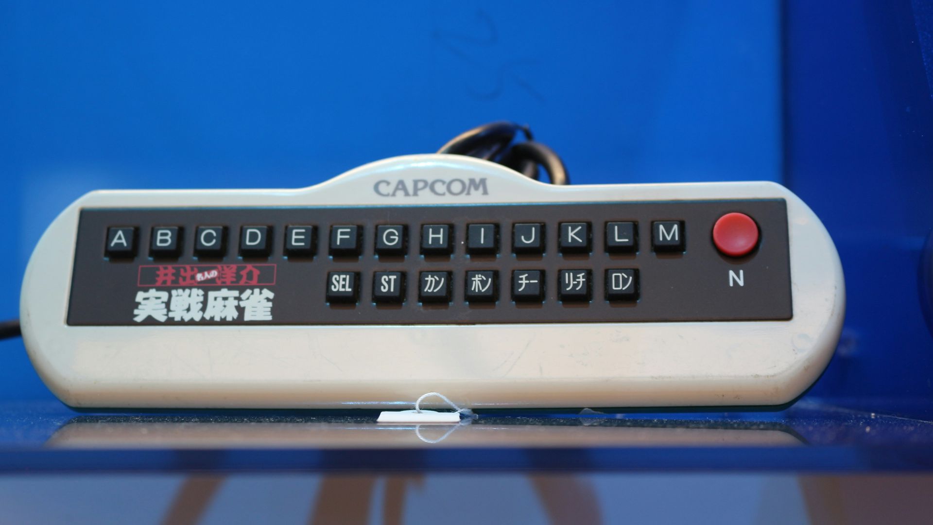 A remote control sitting on top of a table