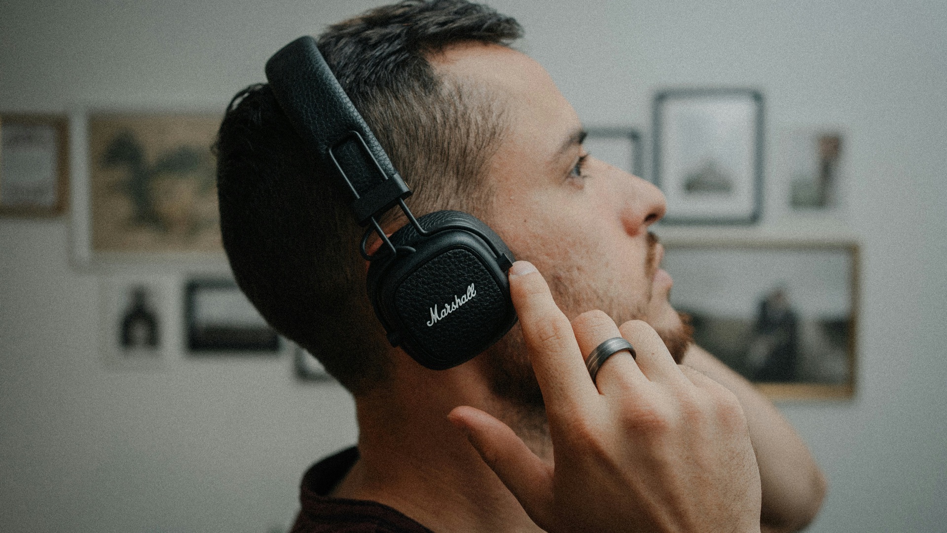 a man wearing headphones while talking on a cell phone
