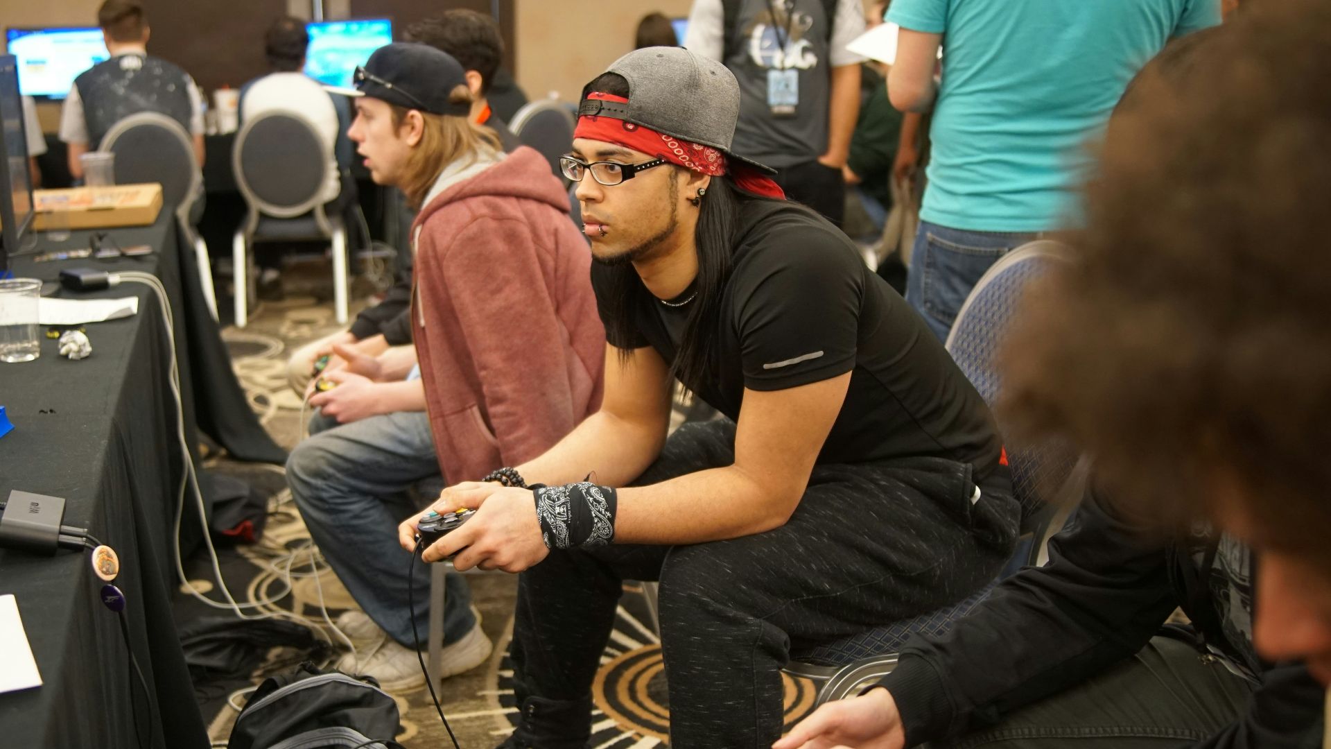 man sitting on chair playing games