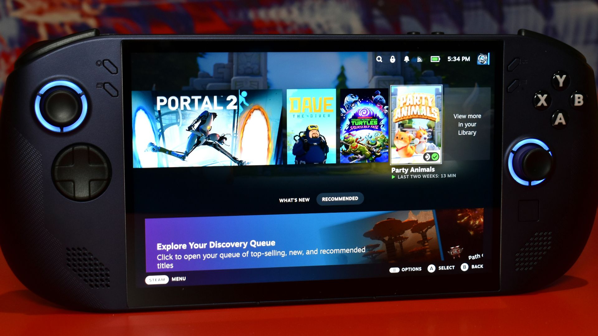 Handheld gaming device displaying game library