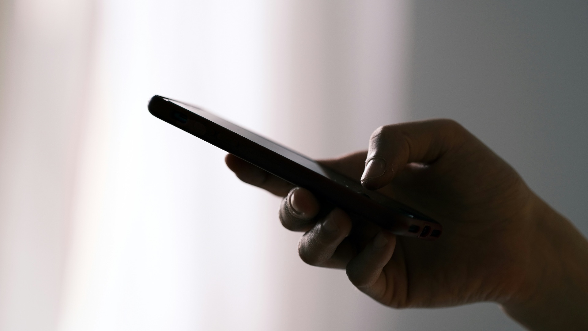 person holding black android smartphone