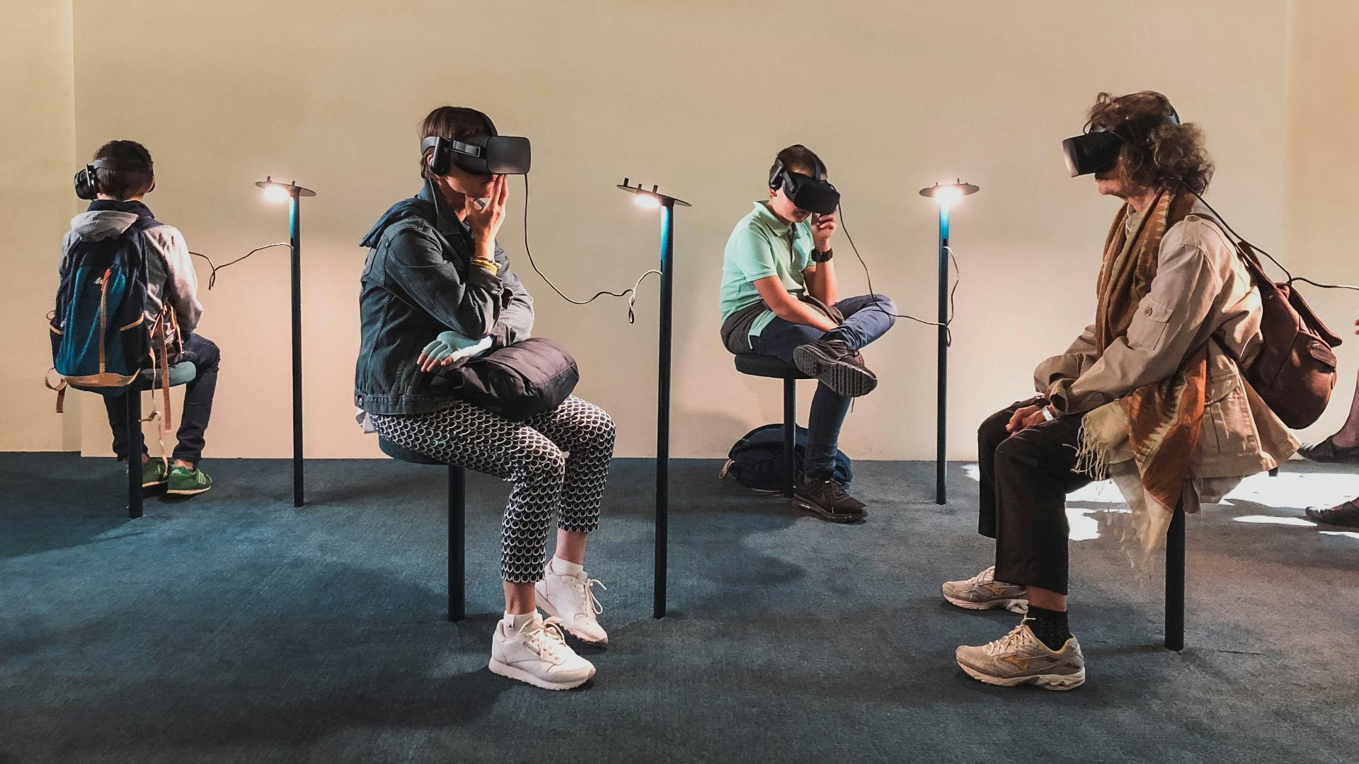 four person playing virtual reality goggles