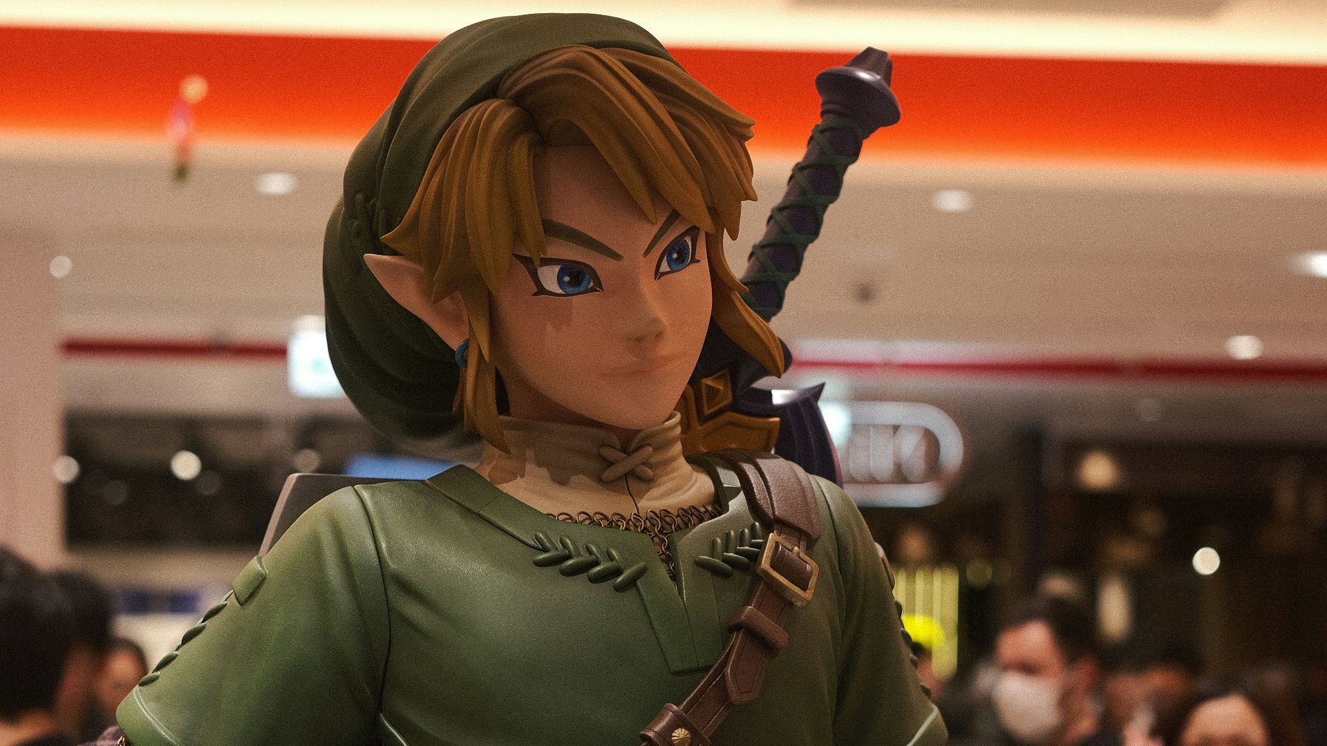 a statue of a woman in a green outfit