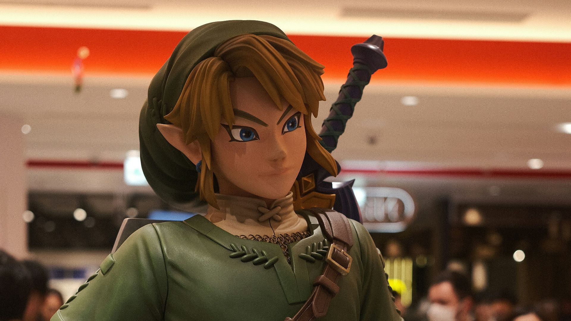 a statue of a woman in a green outfit