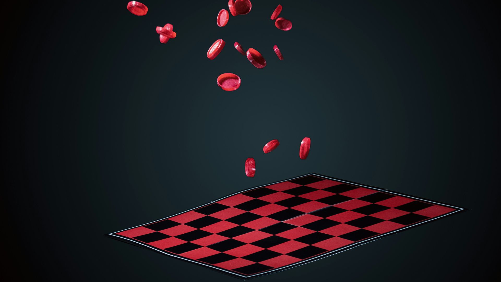 a black and red checkered rug with red petals coming out of it