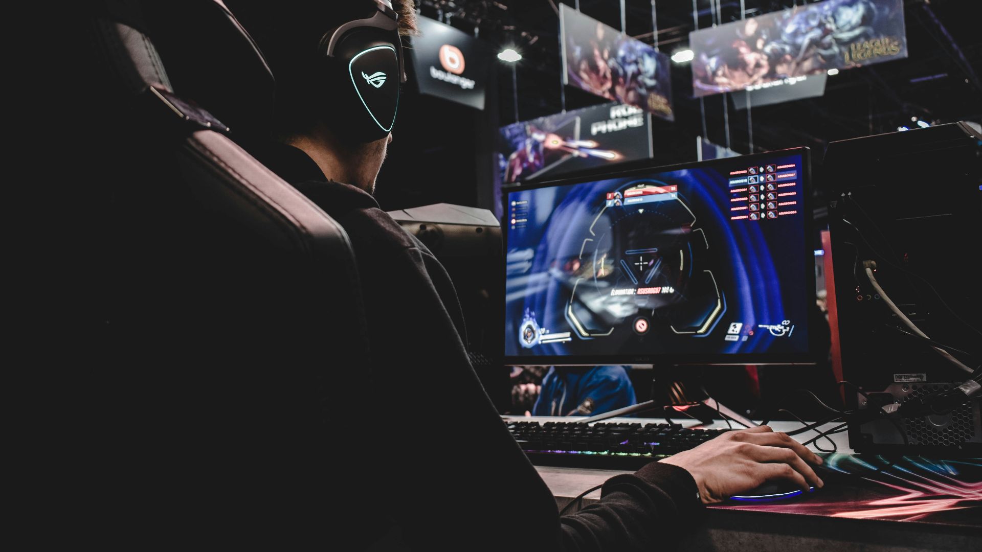 person sitting on gaming chair while playing video game
