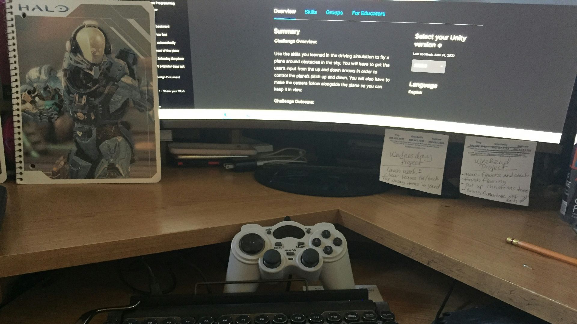 a computer desk with a keyboard and a monitor