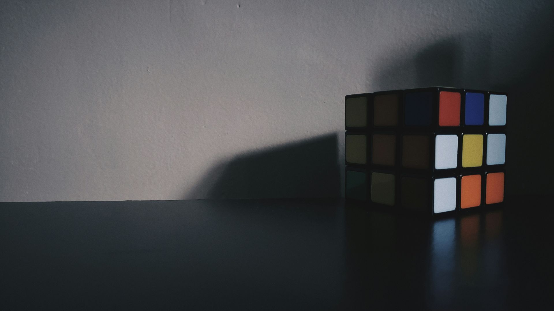 3 x 3 rubiks cube on black table