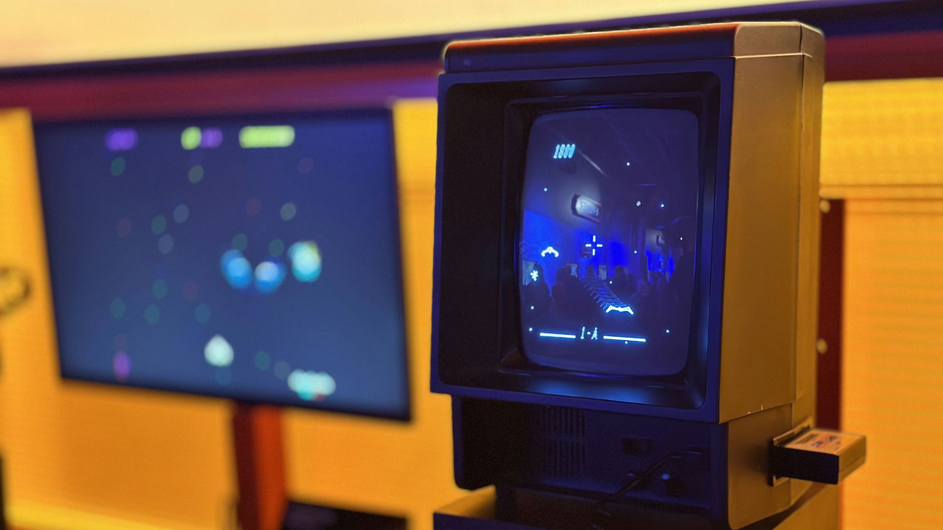 a small tv sitting on top of a wooden stand